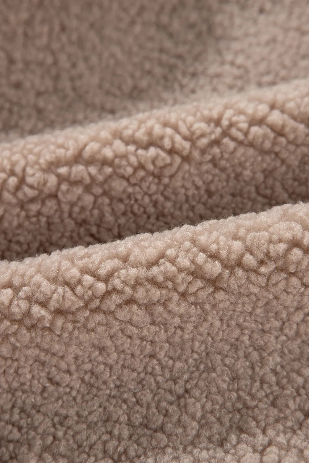 Teddy bomber jacket in mocha showing fluffy sherpa fabric texture.