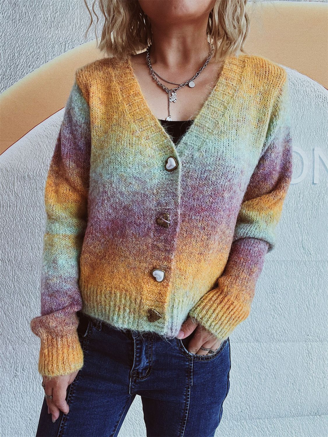 Ombre knit cardigan with heart buttons and V-neck.