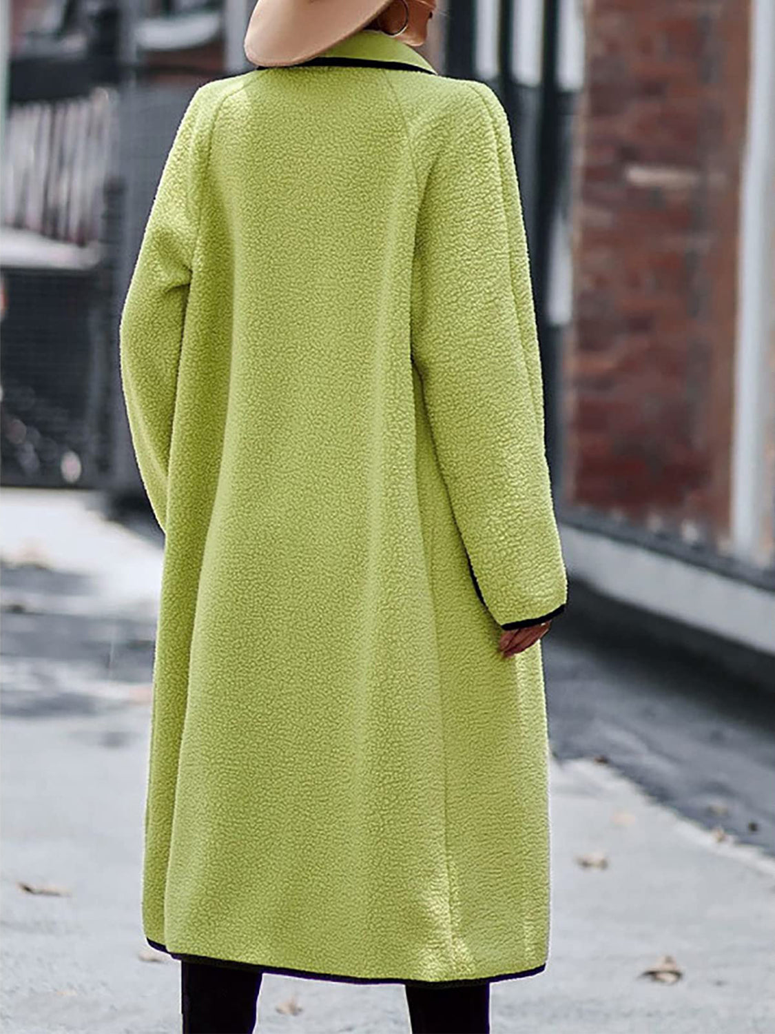 Lime teddy coat with black contrast trim detailing, long sleeves, and a relaxed fit.