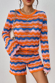 Crochet flare set with orange-red, blue, and pink wavy stripes, bell sleeves, and shorts.