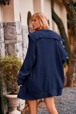 Navy oversized hooded knit cardigan with wide collar and pockets.