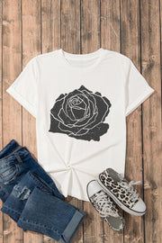 White t-shirt with distressed black rose graphic and rolled sleeves.