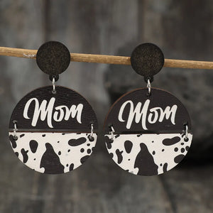 Textured wood statement earrings with "Mom" text and cow print detail