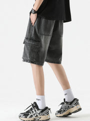 Black denim cargo shorts with drawstring and multiple pockets.