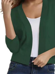 Mid Green cropped knit cardigan with elbow sleeves and open front, styled over a white tank top.