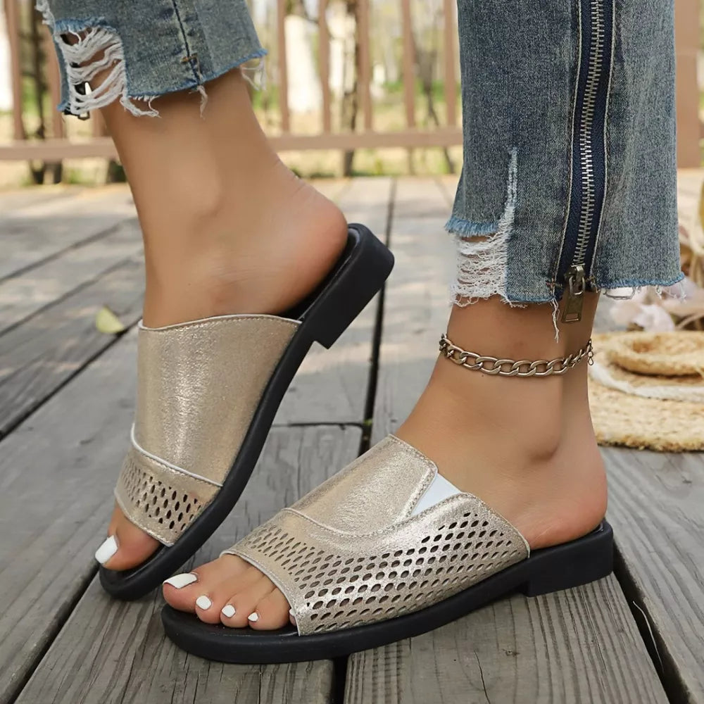 Chic gold hollow-out slide sandals with breathable perforated detail.