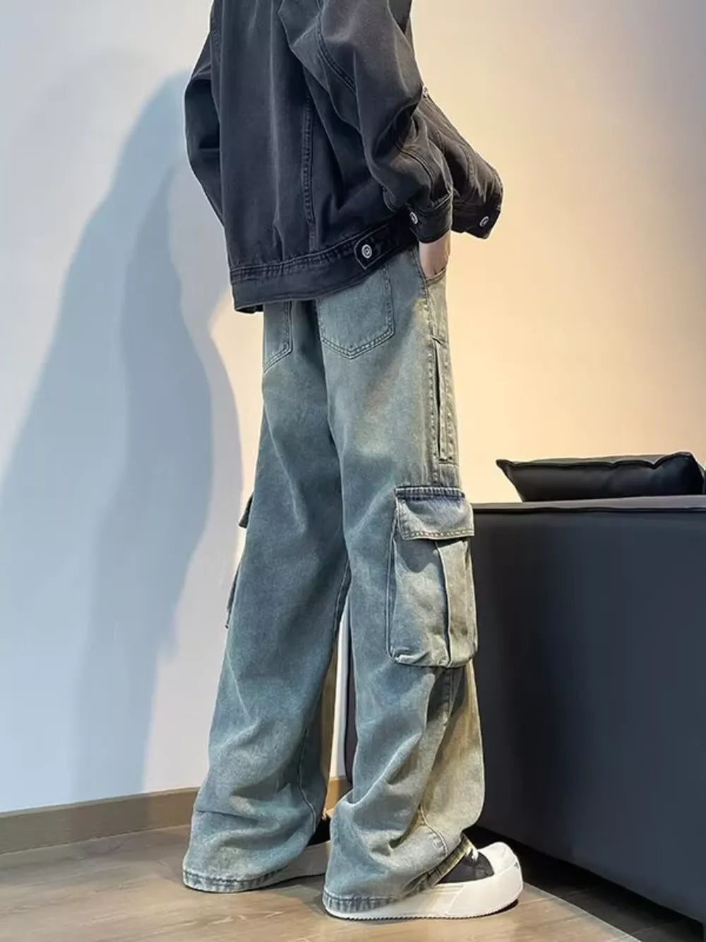 Vintage wash oversized wide-leg cargo pants with distressed details and ankle pooling.