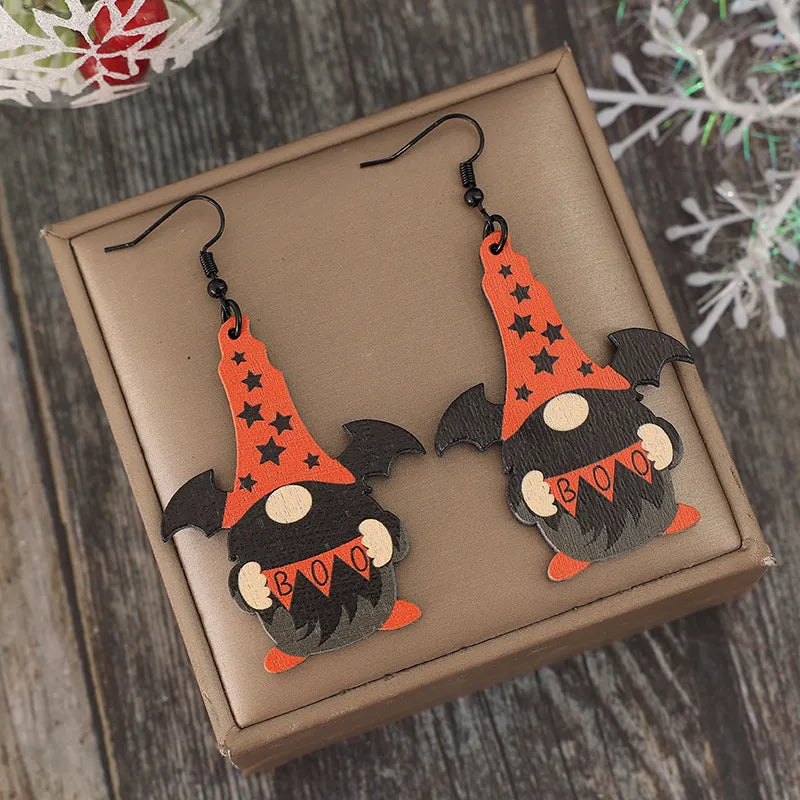 Black Halloween gnome wood drop earrings with bat wings and "BOO" banner.