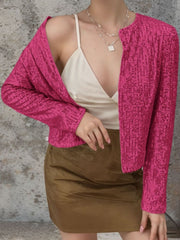Hot Pink sequin bolero jacket with long sleeves and a collarless neckline.
