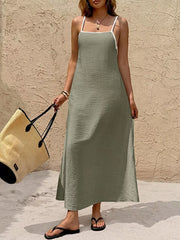 Olive spaghetti strap maxi dress with contrasting white trim and a-line cut.