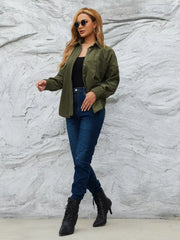 Olive green corduroy button-up shirt with a relaxed fit, worn open over a black tank top and jeans.
