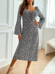 Floral print midi dress with flare sleeves and tie-neck detail in black and white.