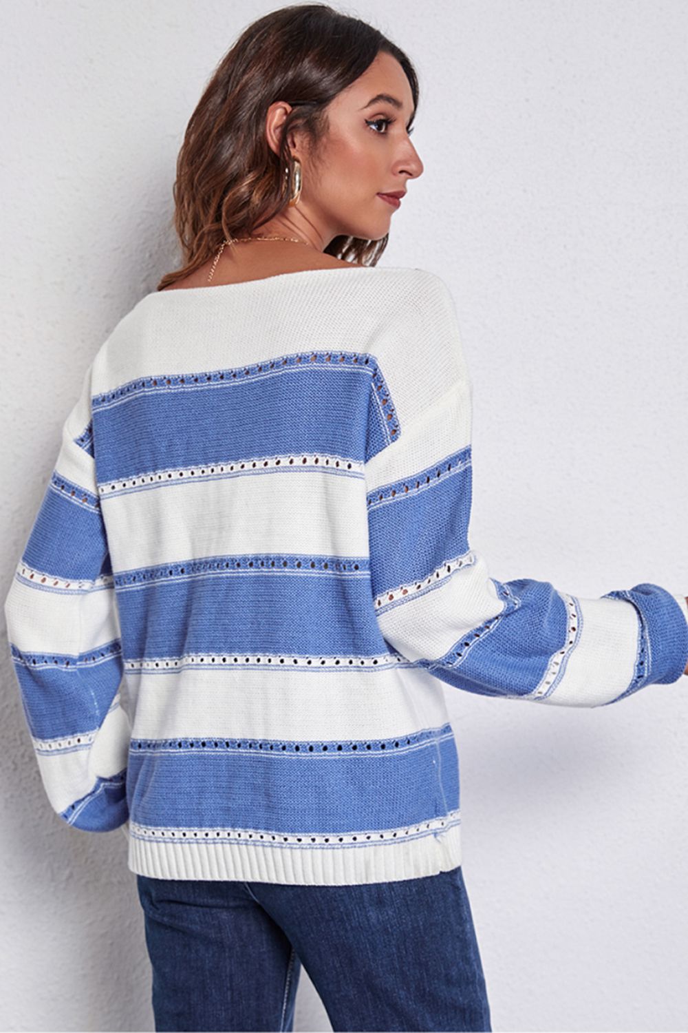 Blue and white striped off-shoulder knit sweater with perforated details