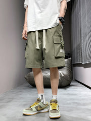 Men's green lightweight cargo shorts with drawstring and multiple pockets.