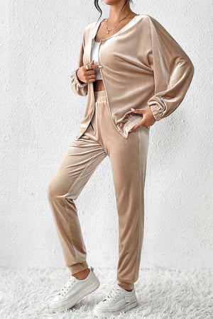 Tan velvet tracksuit joggers and zip-up jacket with elastic cuffs and waistband.
