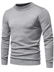 Gray ribbed mock neck sweater with sculpted shoulder detail and ribbed cuffs and hem.