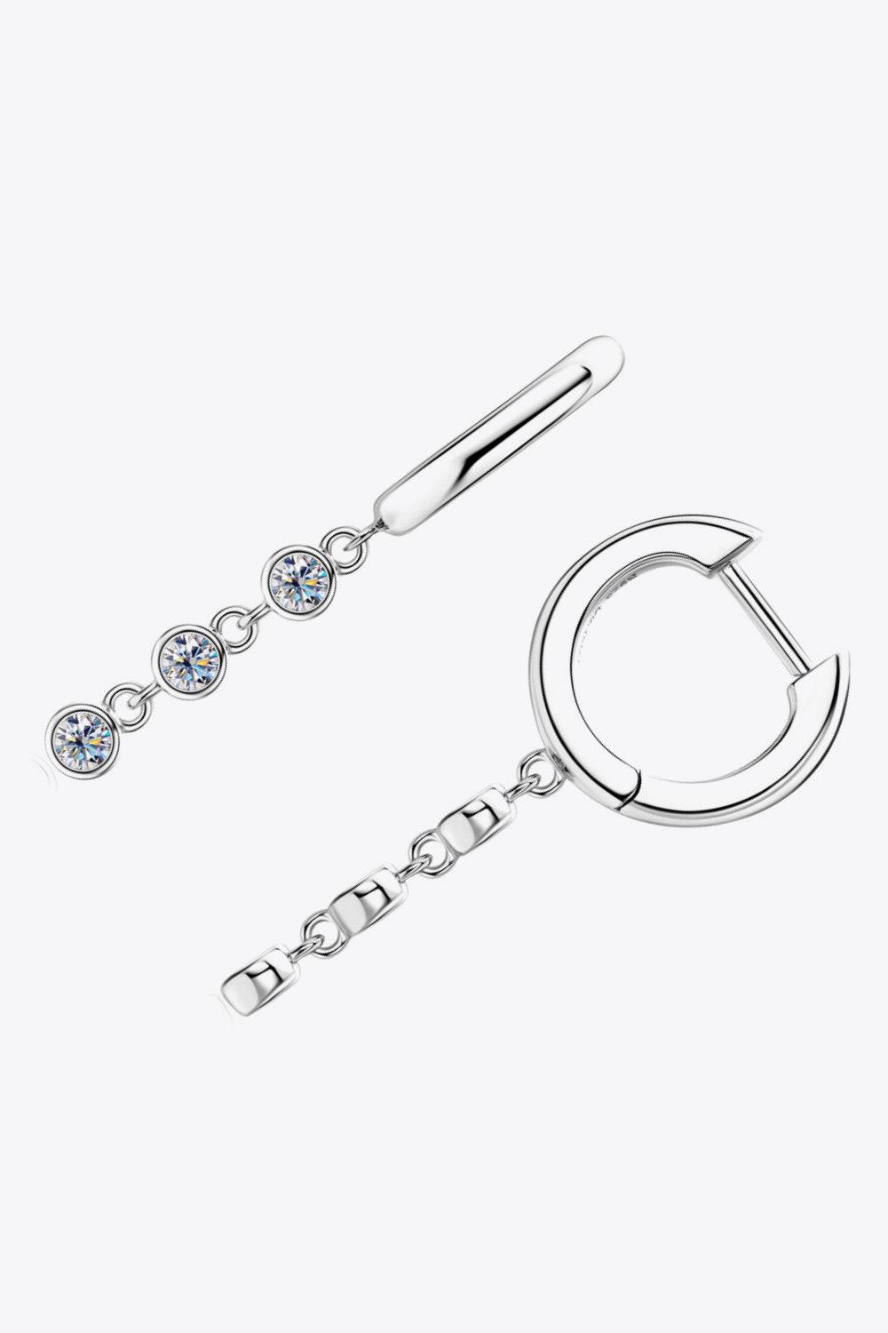 Silver hoop earrings with dangling chain featuring three clear gemstones and a bar accent.