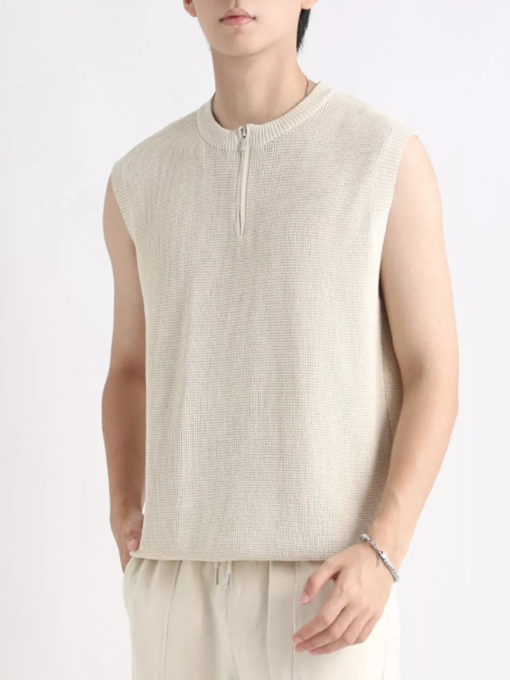 Textured knit quarter-zip men's tank in apricot with a waffle pattern.
