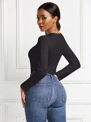 Black long sleeve ribbed bodysuit with a body-hugging fit.