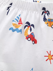 White cotton boys' shorts with playful car, sailboat, palm tree, and sun print.
