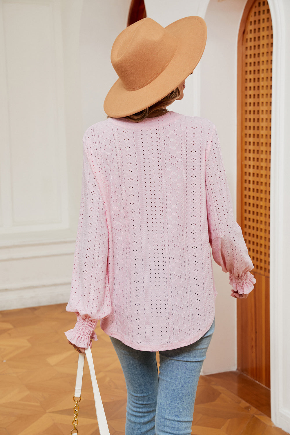 Blush pink eyelet detail poet sleeve blouse with ruffled cuffs.