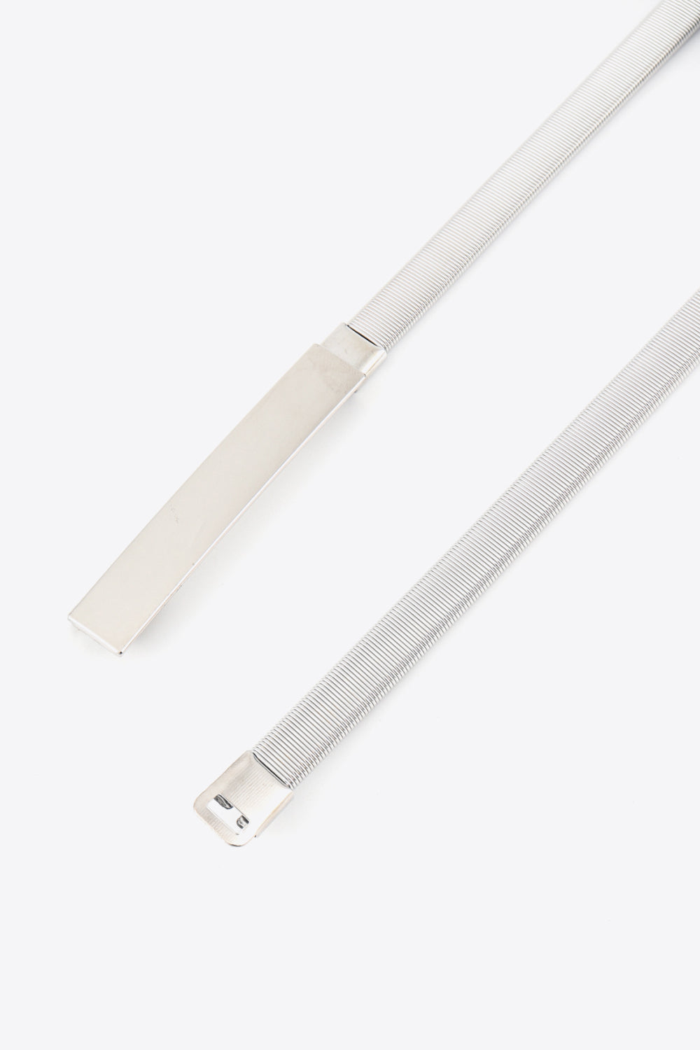 Silver metal elastic waist belt with adjustable buckle detail