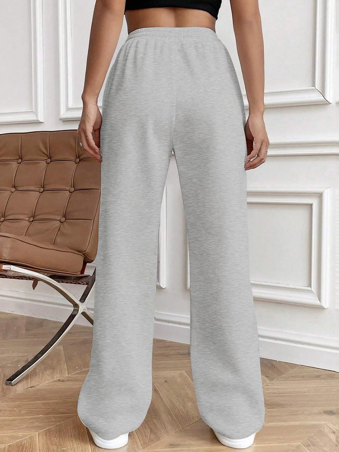 Light gray pleated palazzo drawstring trousers with a wide leg