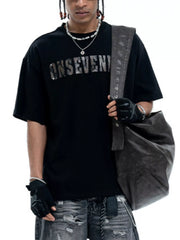Black oversized cotton t-shirt with a distressed silver logo graphic and crew neck.