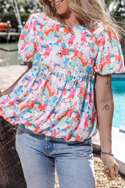 Multicolor watercolor village print peplum blouse with puff sleeves and elasticated hem.