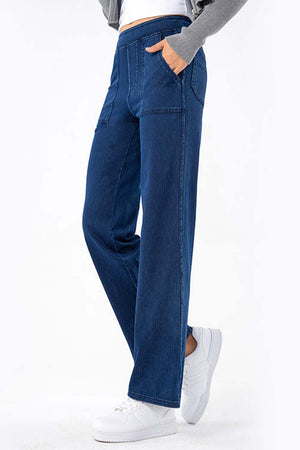 Dark wash denim straight leg jeans with utility pockets and elastic waistband.