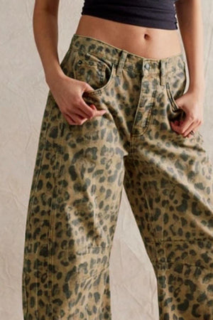Leopard print denim barrel leg pants with button fly and pockets.