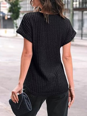 Black ribbed knit t-shirt with cuffed short sleeves and a relaxed fit.