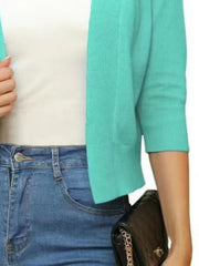 Azure open-front cropped cardigan with elbow sleeves and ribbed cuffs.
