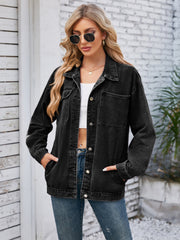 Oversized dark blue denim jacket with hood detail, buttoned front and chest pockets.