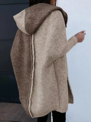 Two-tone hooded knit cardigan in camel and brown acrylic with a split hem.