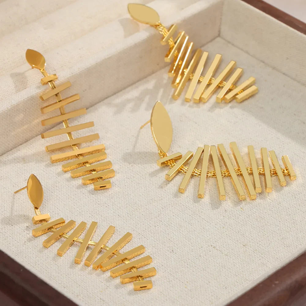 Gold geometric steel fishbone drop earrings with modern design