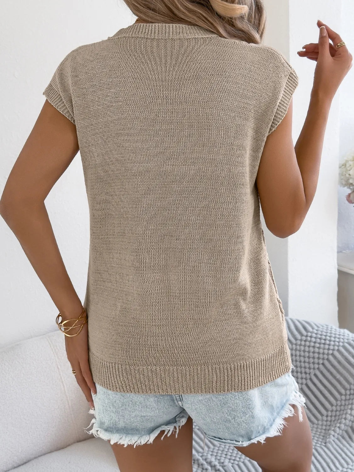 Khaki diamond knit sleeveless sweater top with ribbed hem and cuffs.