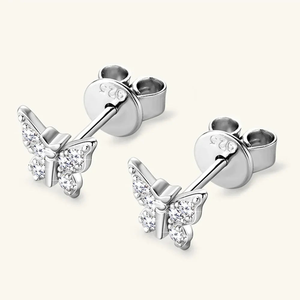 Silver moissanite butterfly stud earrings with clear stones.