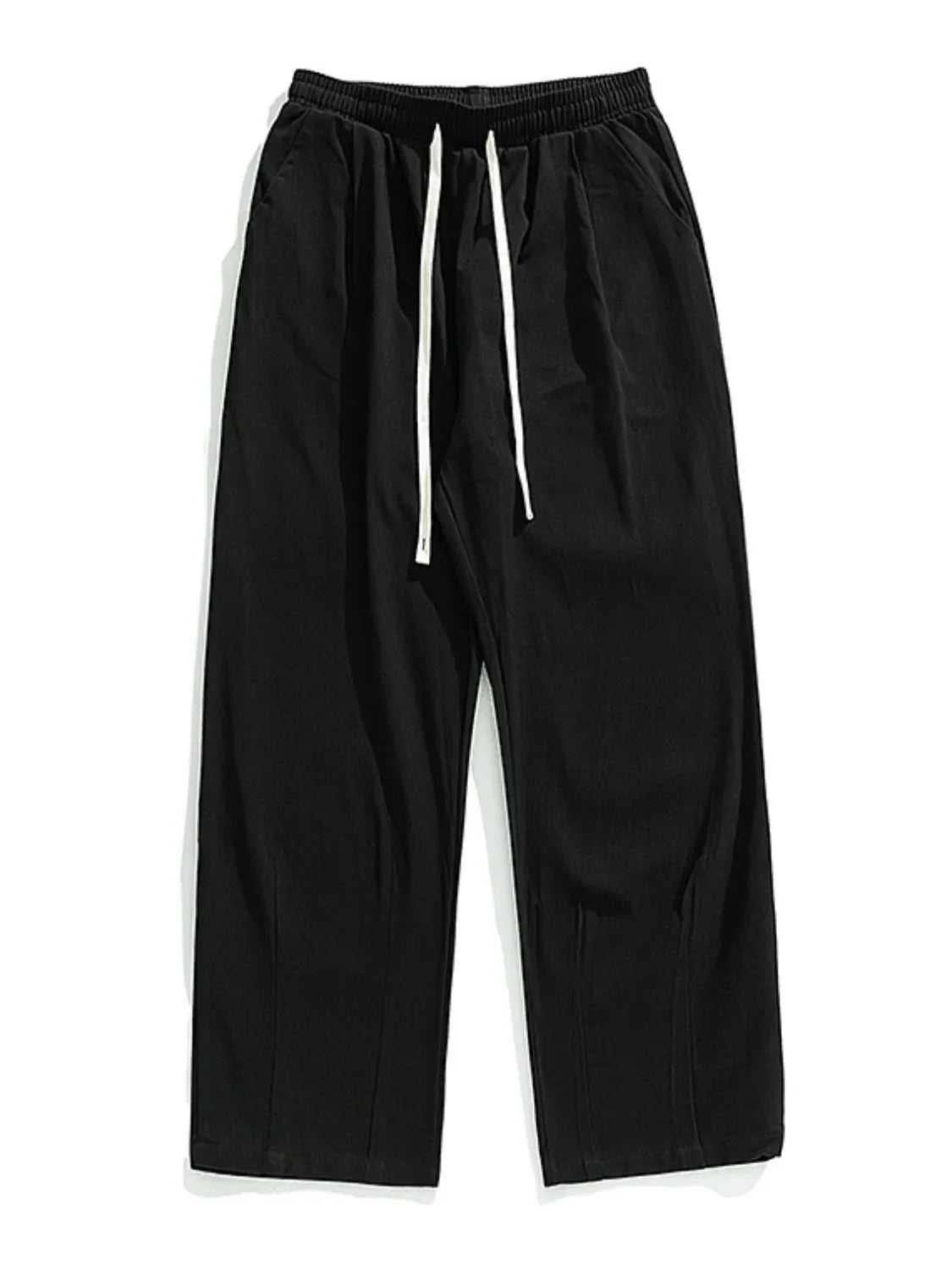 Black wide-leg pleated trousers with drawstring and front pleats