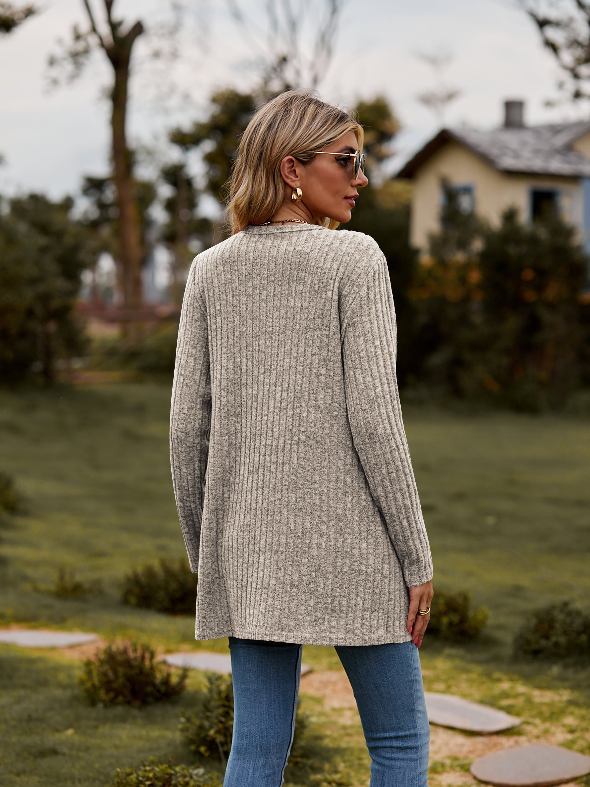 Longline ribbed knit button-down cardigan in beige with long sleeves and a relaxed fit.
