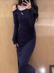 Navy cutout asymmetrical long sleeve maxi dress with a keyhole neckline and side slit.
