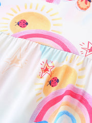 Toddler dress with rainbow, sun, ladybug, and star print on white fabric