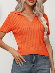 Orange cable knit short sleeve polo sweater with a V-neck.