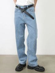 Light blue relaxed-fit denim jeans with subtle seam detail and a black belt.
