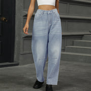 Relaxed light wash denim trousers with patchwork knee details and a wide leg.
