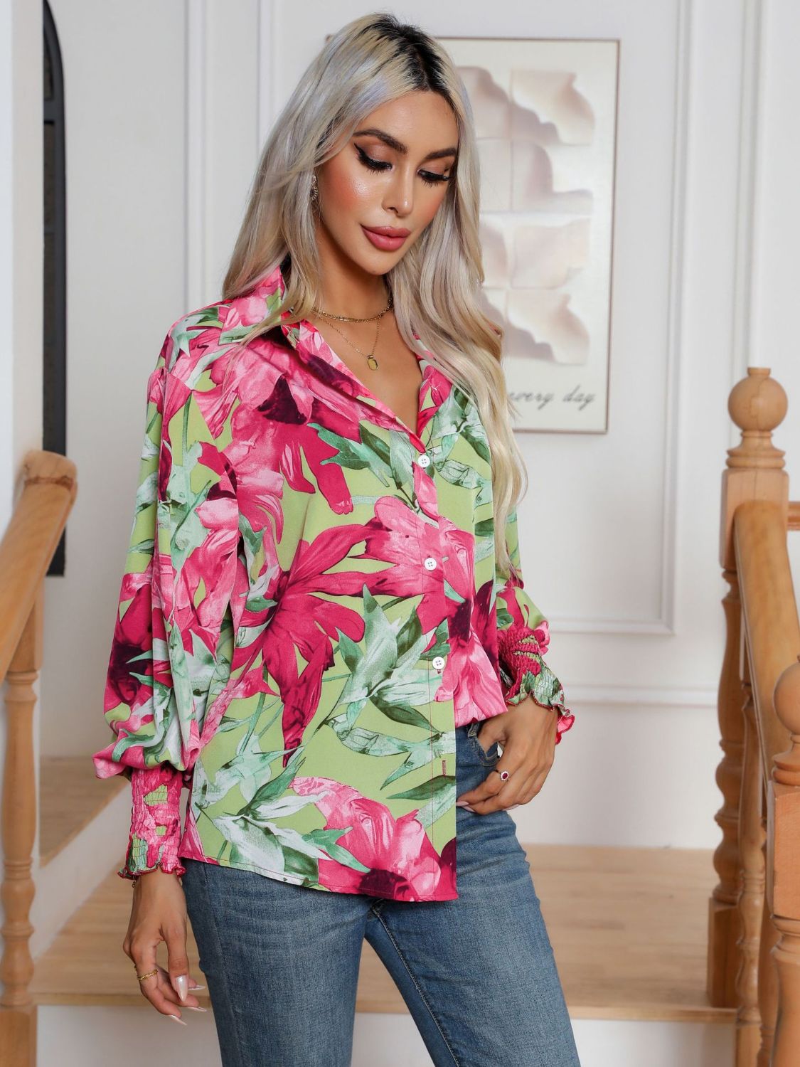 Floral print blouson sleeve button-up shirt with smocked cuffs in light blue and hot pink.