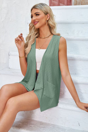 Sage eyelet drape front vest with pockets and open neckline.