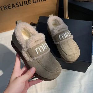 Logo strap shearling loafers in sage with white embroidered logo detail and fluffy lining.
