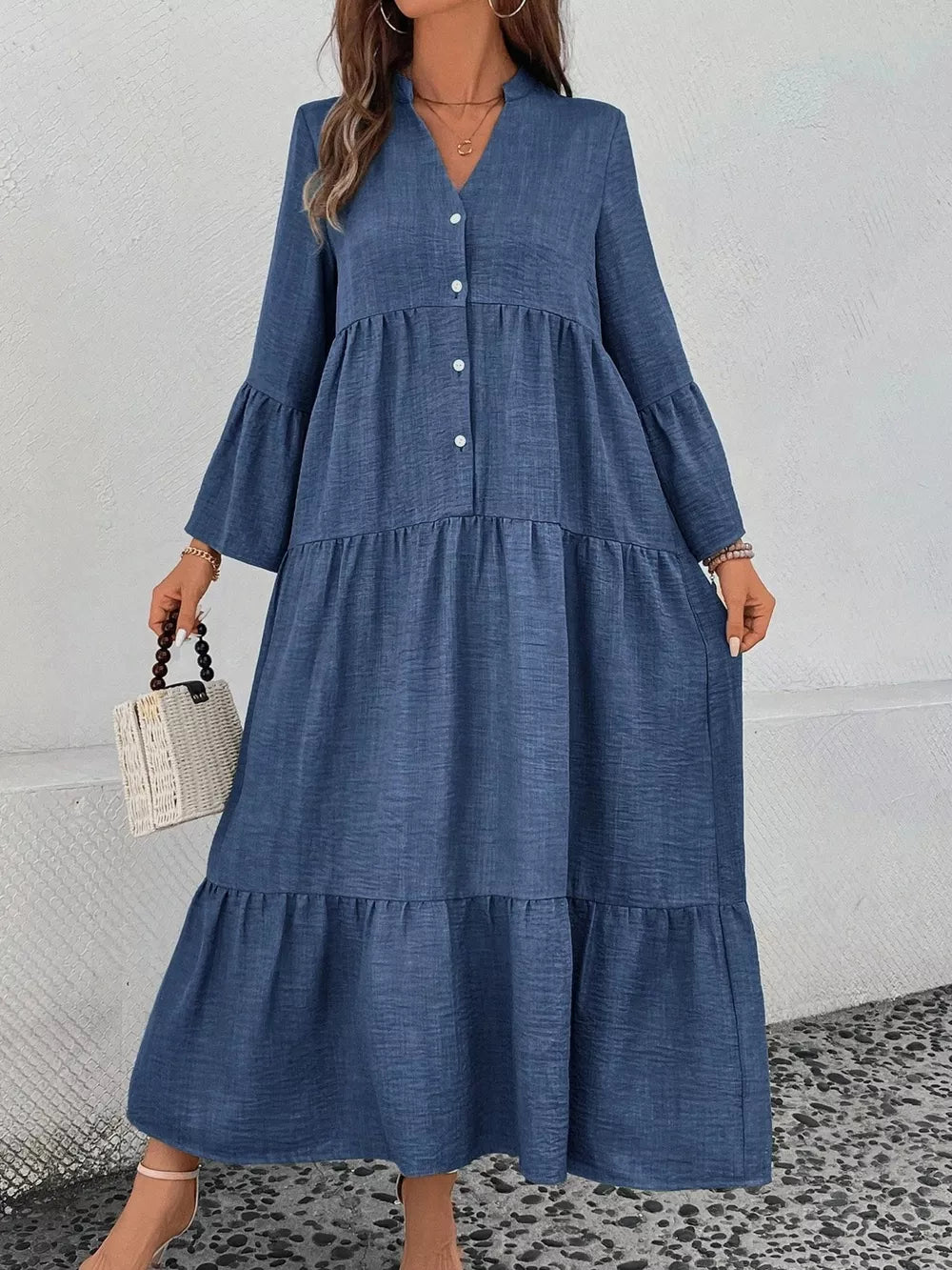 Blue tiered ruffle hem V-neck dress with button front and bell sleeves.