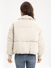 Cream padded bomber jacket with ribbed cuffs and collar, shown from the back.